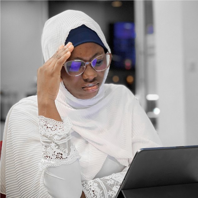 Woman in a hijab working on a tablet